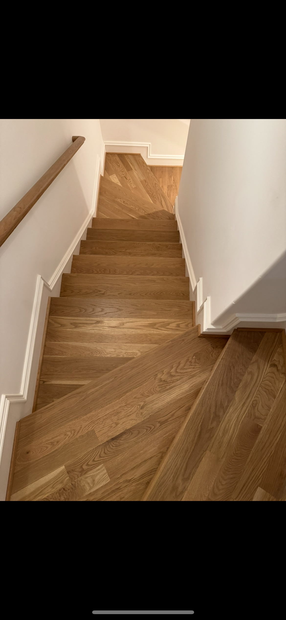 Bare hardwood staircase before custom stair runner installation by Underfoot Design - project 2