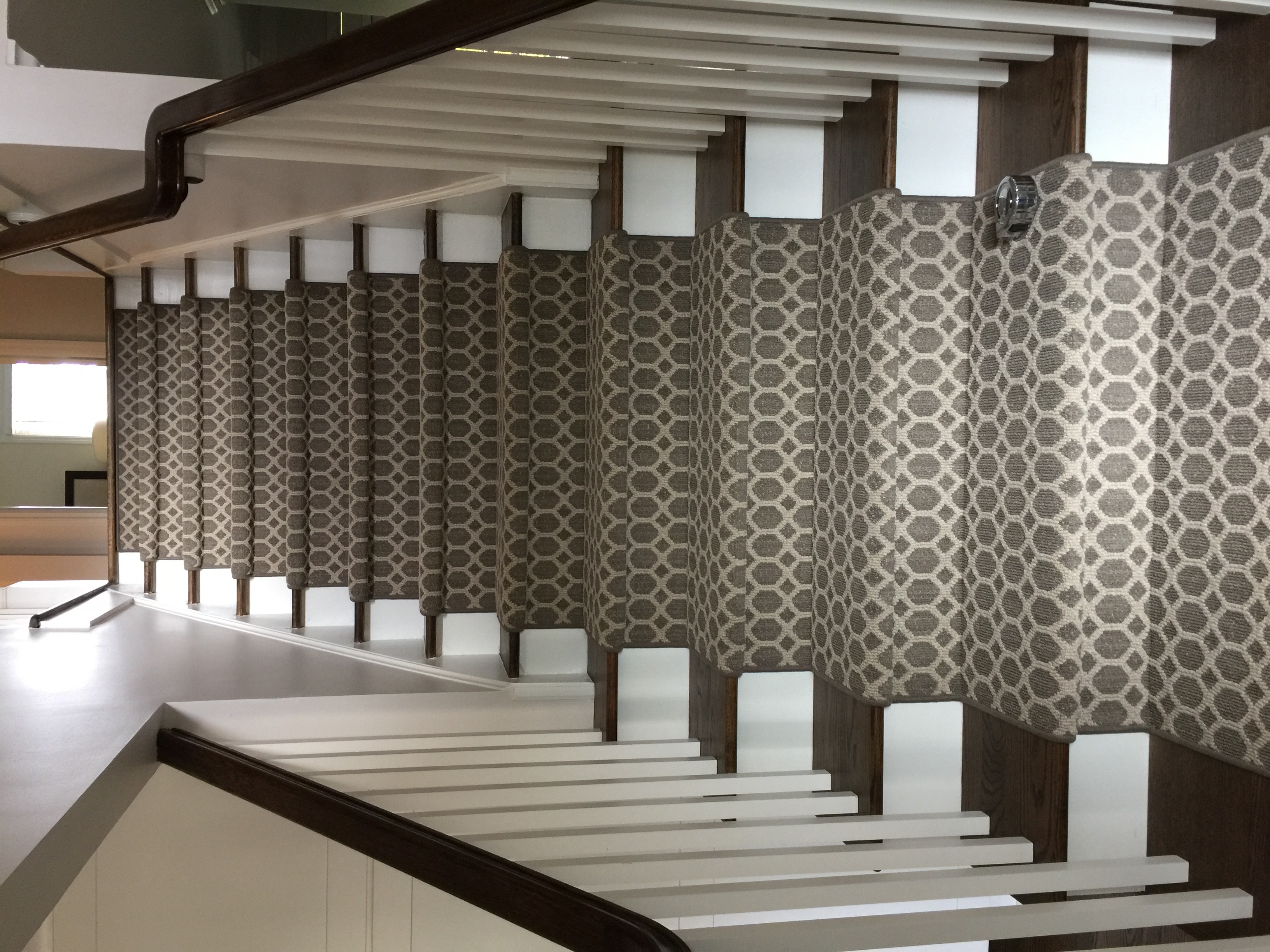 Geometric patterned runner on curved staircase