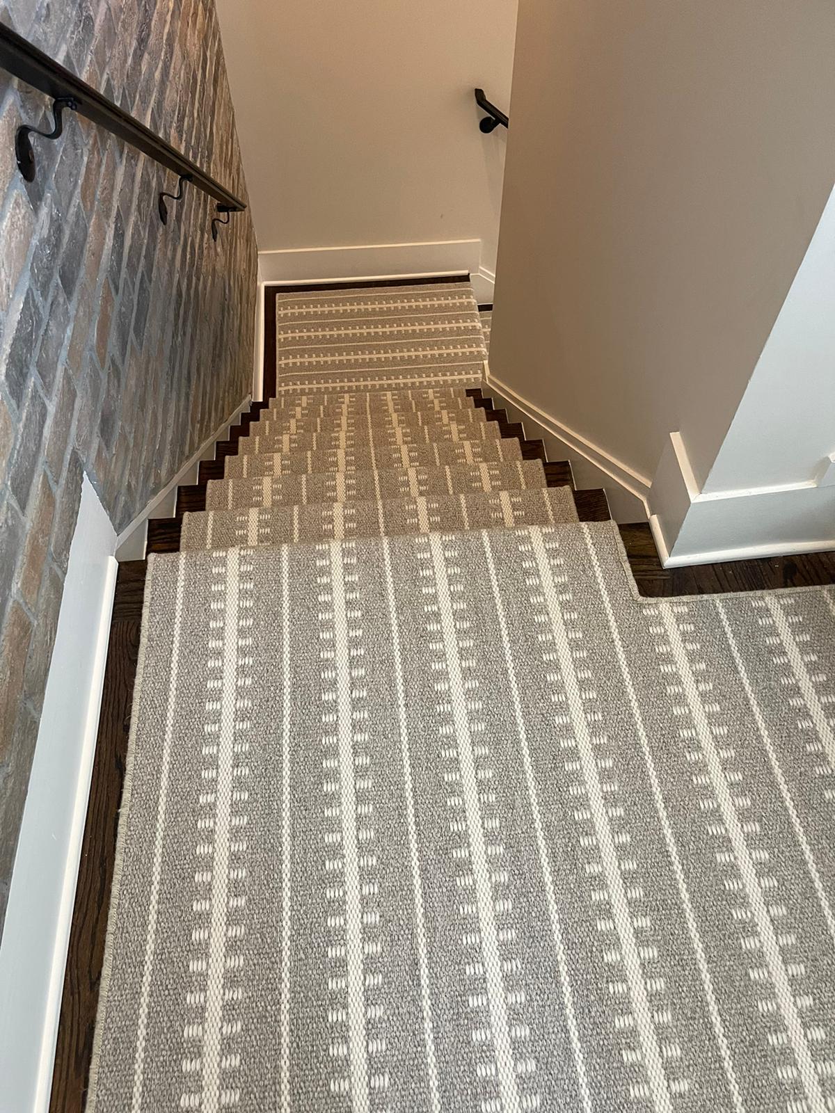 Gray and cream geometric striped runner with wallpaper accent