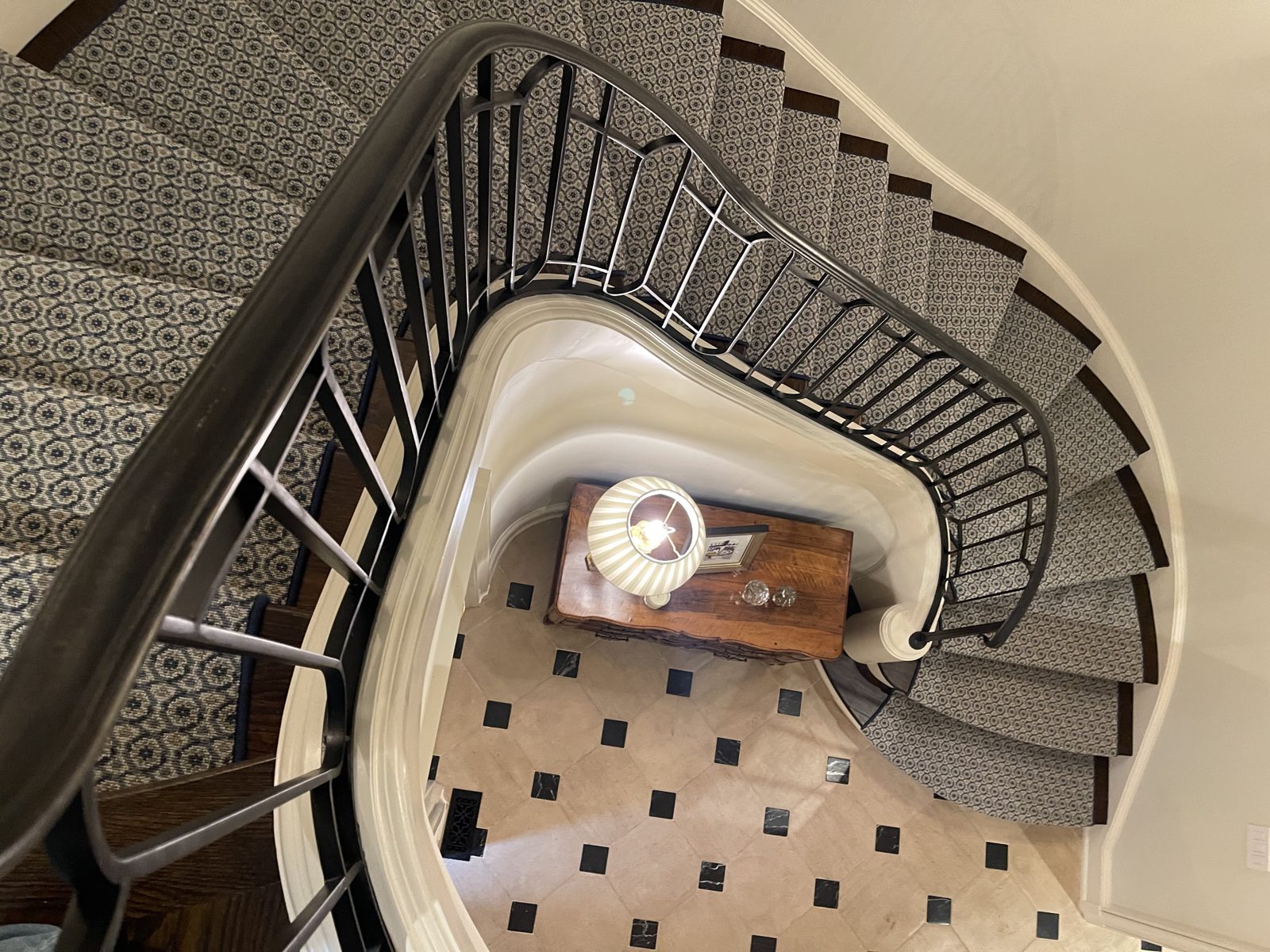 Overhead view of a geometric stair runner on a spiral staircase