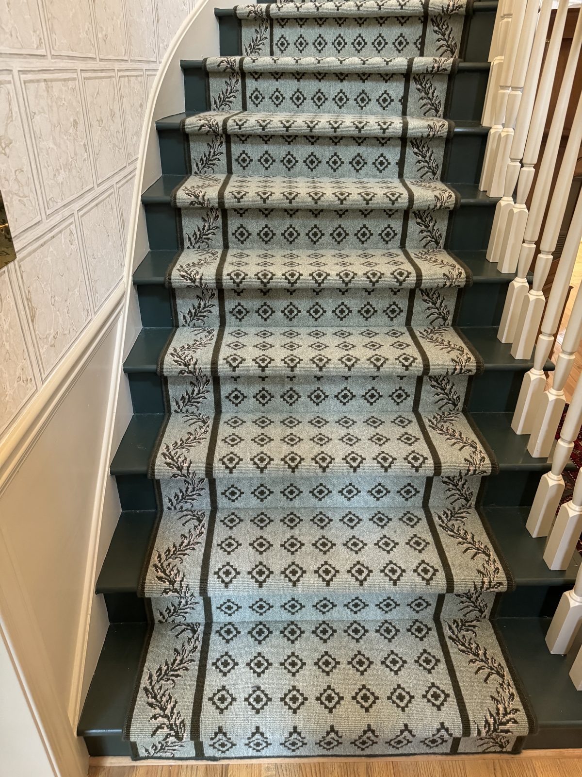Geometric trellis-pattern stair runner on a straight staircase