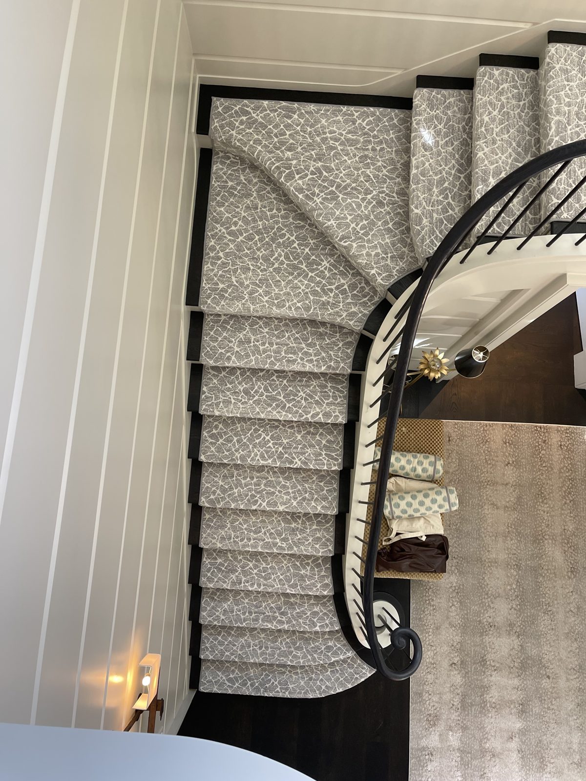 Animal-print stair runner on a spiral staircase viewed from above