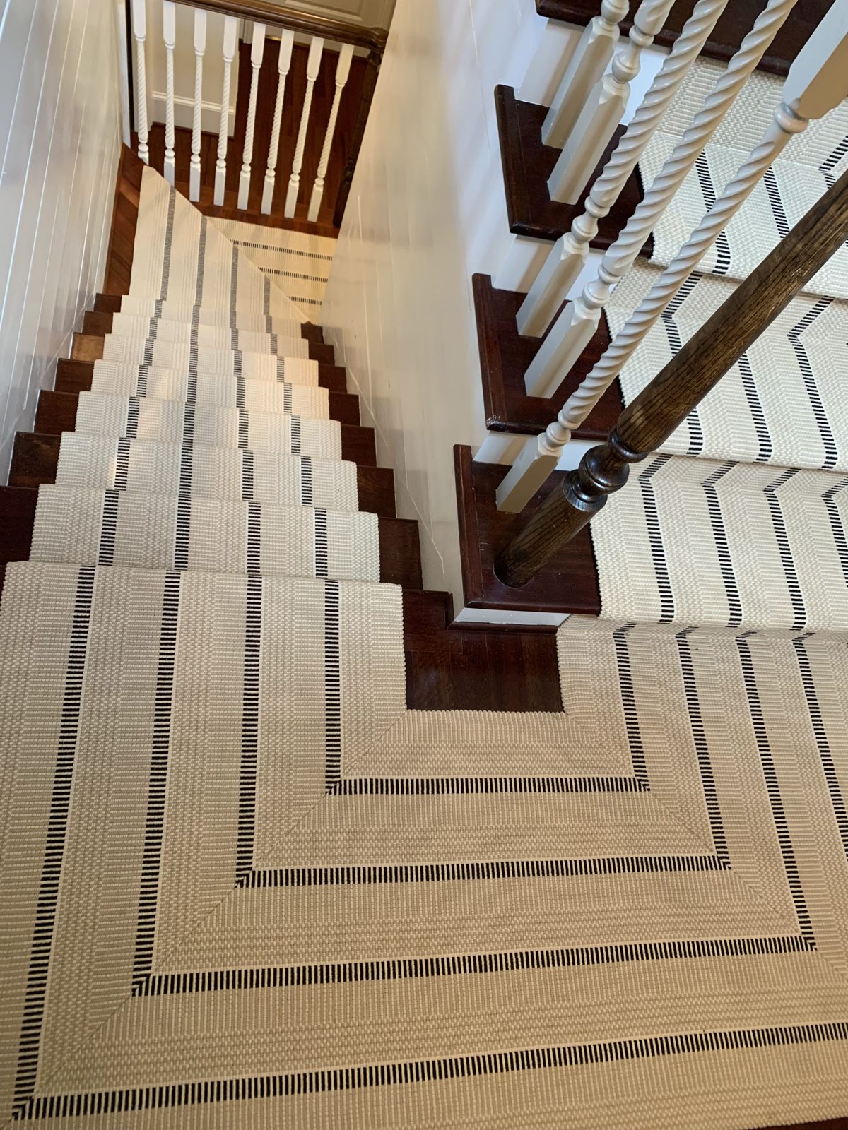 Striped stair runner on a spiral staircase from above
